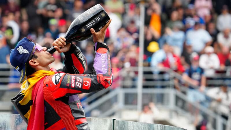 Martin drinks atop the podium at Le Mans