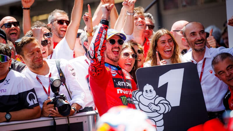 Pecco Bagnaia celebrates victory in 2024 MotoGP Catalan GP in pitlane with crew