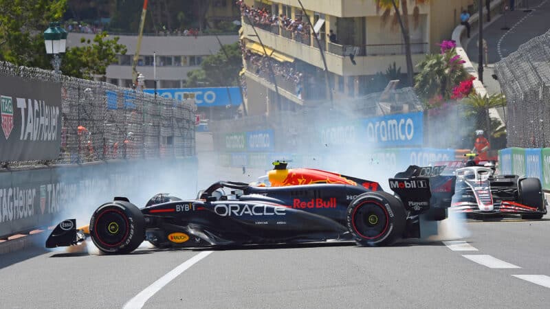 Red Bull of Sergio Perez is slewed sideways in a crash at the start of the 2024 F1 Monaco Grand Prix
