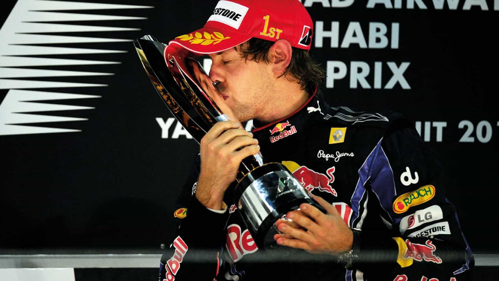Sebastian Vettel kissing trophy