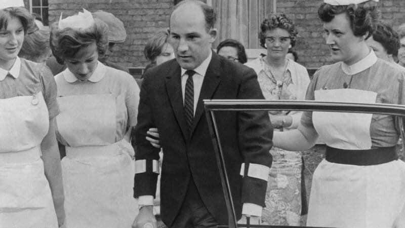 Stirling Moss leaves Atkinson Morley hospital on crutches in 1962