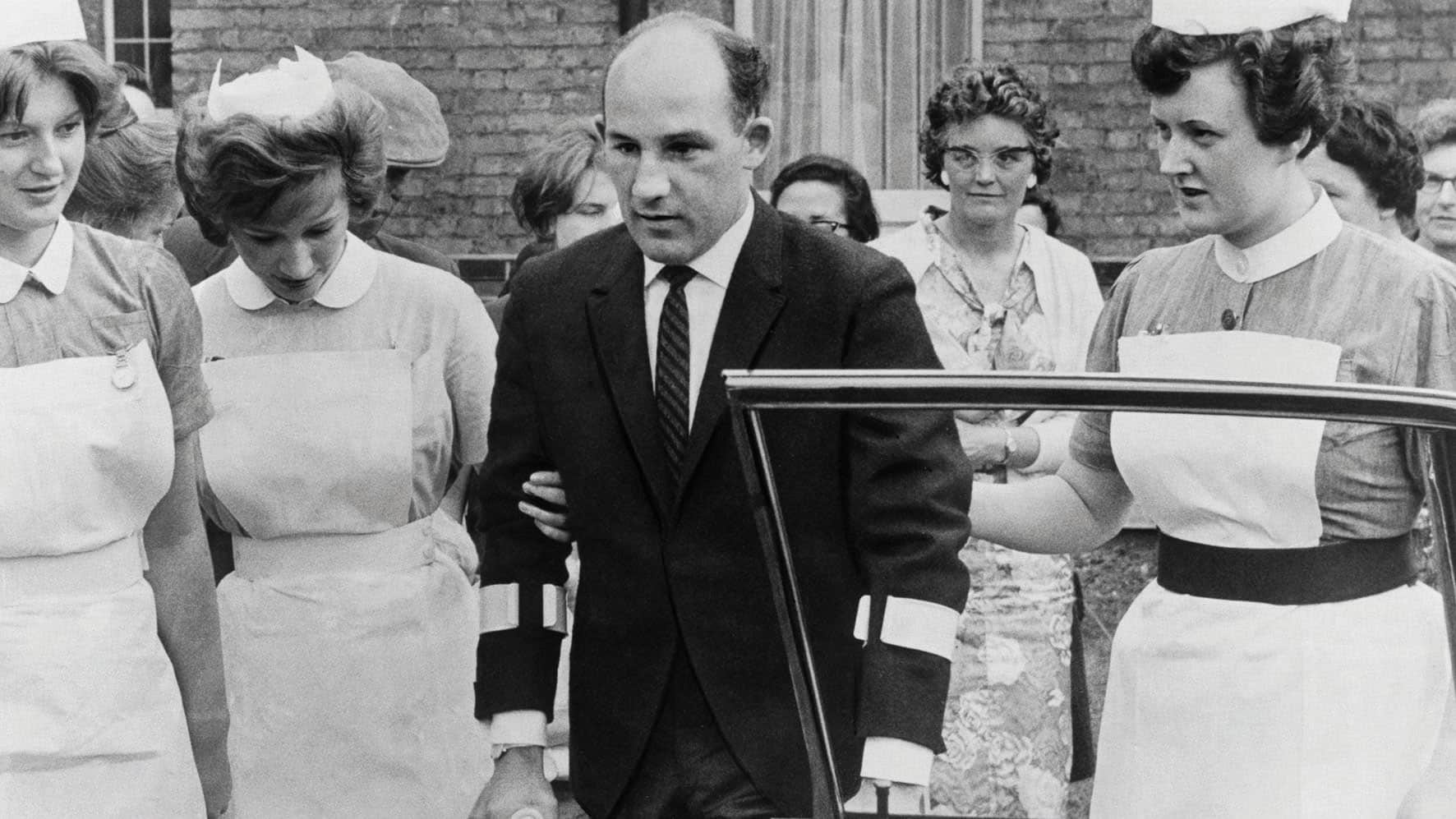 Stirling Moss on crutches