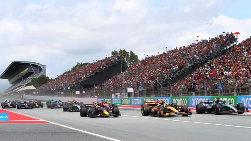 George Russell alongside Lando Norris and Max Verstappen at the start of the 2024 F1 Spanish Grand Prix