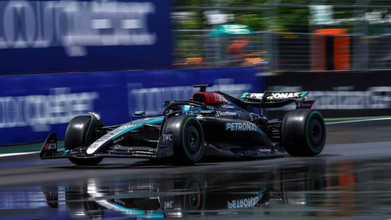 Mercedes of George Russell is reflected in a puddle during 2024 F1 Canadian Grand Prix