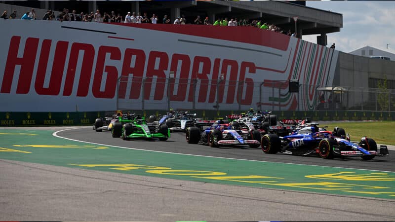 Daniel Ricciardo ahead of Yuki Tsunoda at the start of 2024 Hungarian Grand Prix