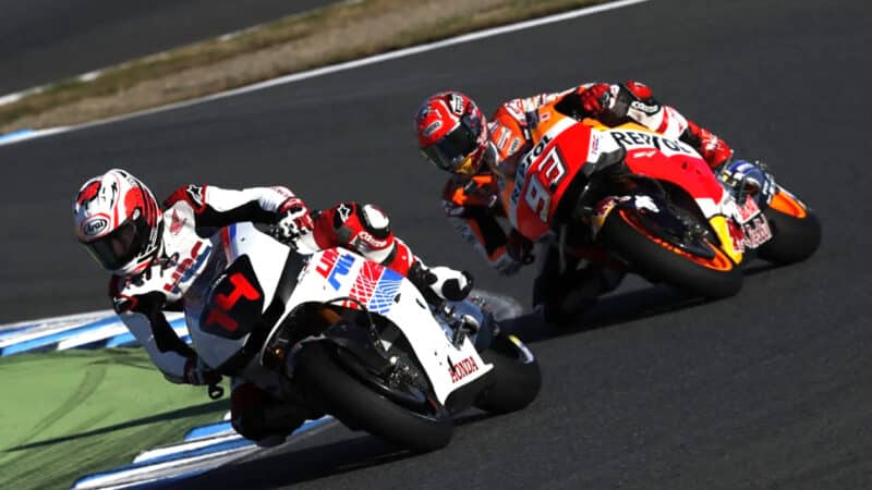 Fernando Alonso and Marc Marquez ride Honda motorbikes on track