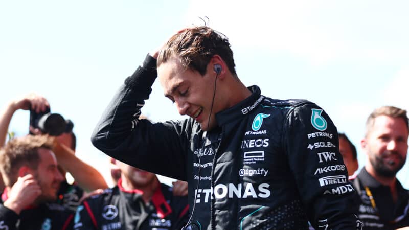 George Russell in front of Mercedes team after crossing the line first in 2024 F1 Belgian Grand Prix