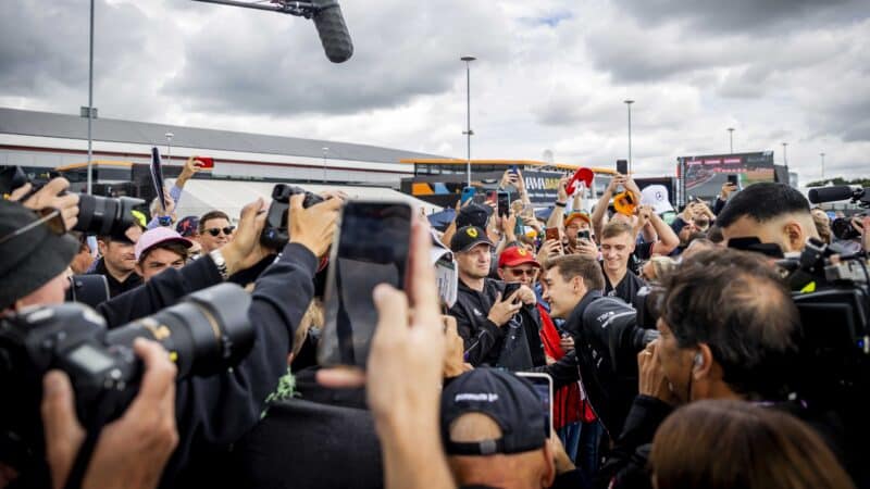 George Russell surrounded by fans and photographers at 2023 F1 British Grand Prix