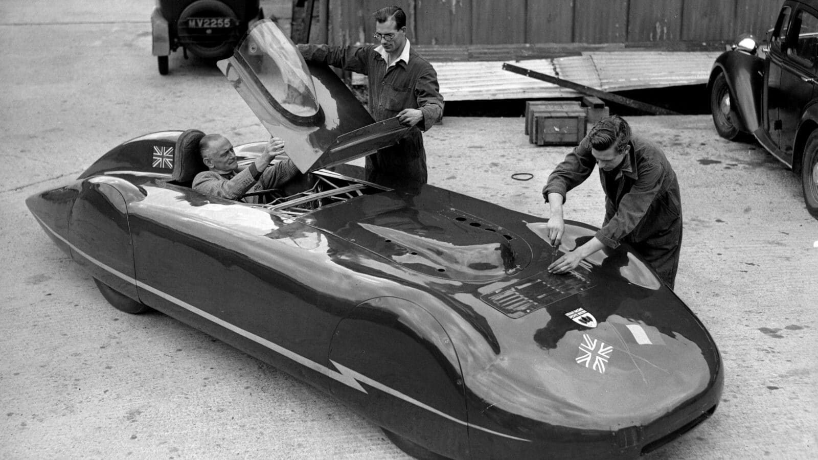 Goldie Gardner at Silverstone in 1949, readying himself for a test run in the MG EX135 speed-record car