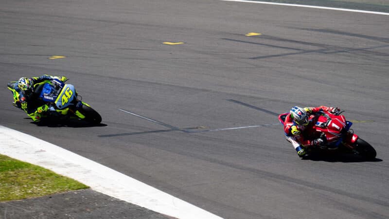 John McGuinness ahead of Valentino Rossi at Silverstone