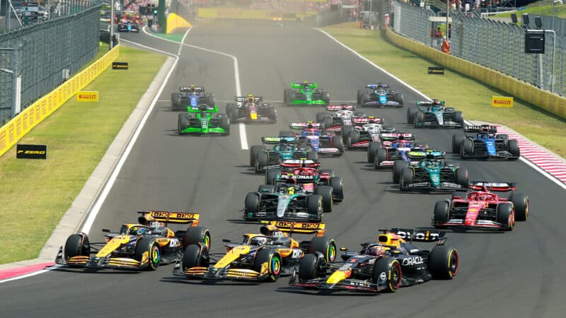 Max Verstappen and both McLarens three abreast at start of 2024 F1 Hungarian Grand Prix