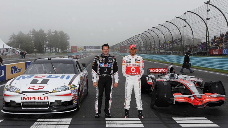 Tony Stewart with McLaren’s Lewis Hamilton in 2011