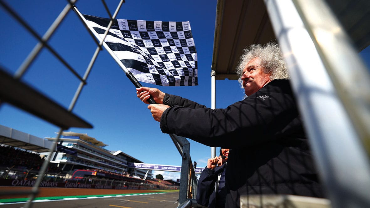 Brian May waves flag