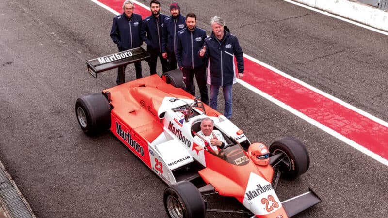 Giacomelli poses alongside the ADM team. This car was its first historic restoration. It is more accustomed to running modern F3 and F4 cars