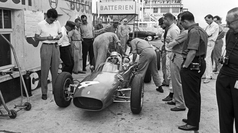 Bandini ready to go in front of Forghieri and Phil Hill at the Nürburgring, 1962