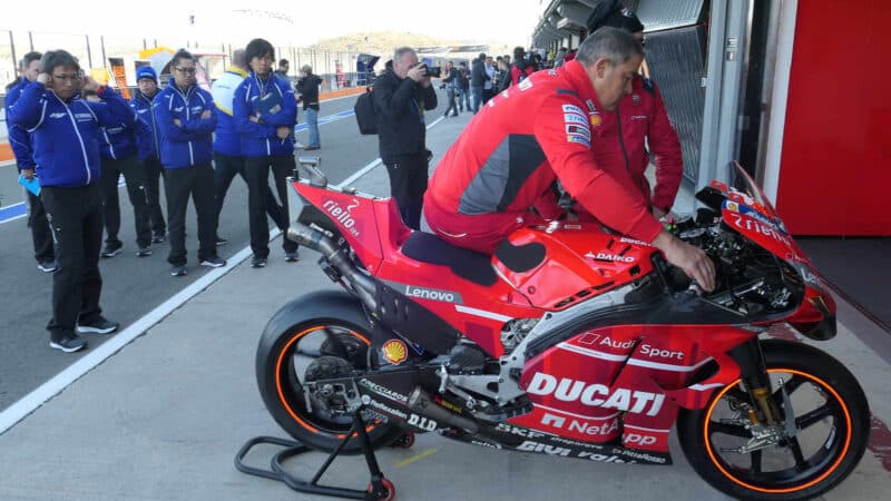 Yamaha engineers check out a factory Ducati during the Valencia tests of November 2019