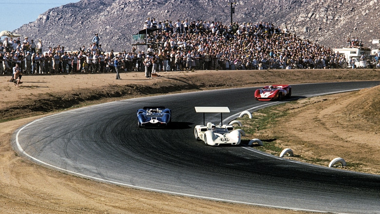 This is the appeal of the Can-Am in a single image. The world’s fastest racing cars, the world’s top drivers — in this case Jim Hall (No66), Mario Andretti (No1) and 1964 F1 world champion John Surtees — duking it out in front of massive crowds at Riverside