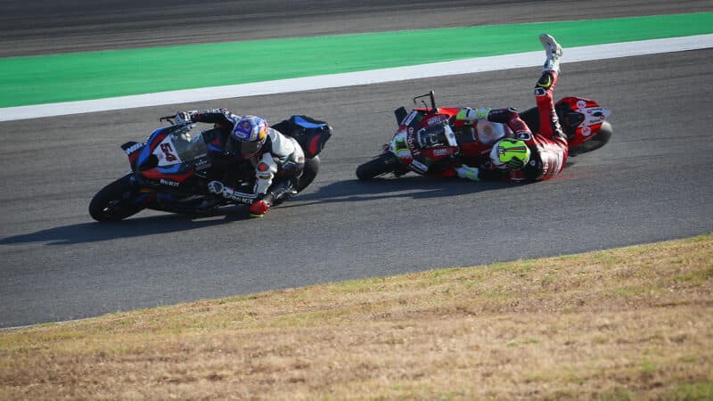 Alvaro Bautista comes of his bike as he chases Toprak Razgatlıoğlu in 2024 World Superbike race