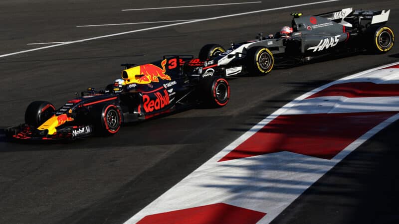 Daniel Ricciardo passes the Haas of Kevin Magnussen in the 2017 F1 Azerbaijan Grand Prix