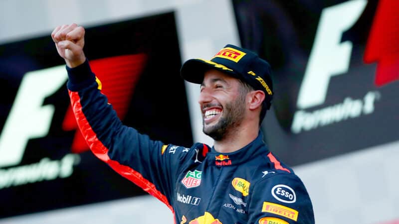 Daniel Ricciardo raises his fist in the air on the podium after winning the 2017 F1 Azerbaijan Grand Prix