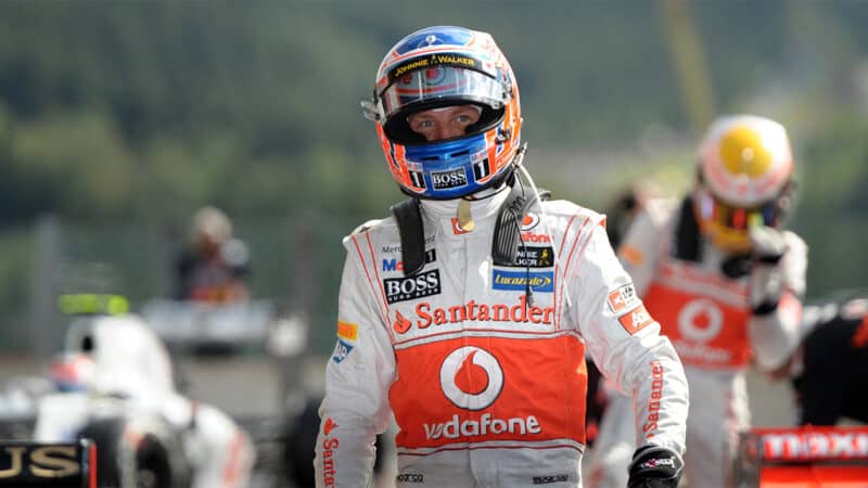 Jenson Button after qualifying in the 2012 F1 Belgian Grand Prix with Lewis Hamilton in the background