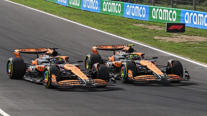 Lando Norris and Oscar Piastri side by side on track at the 2024 Italian GP