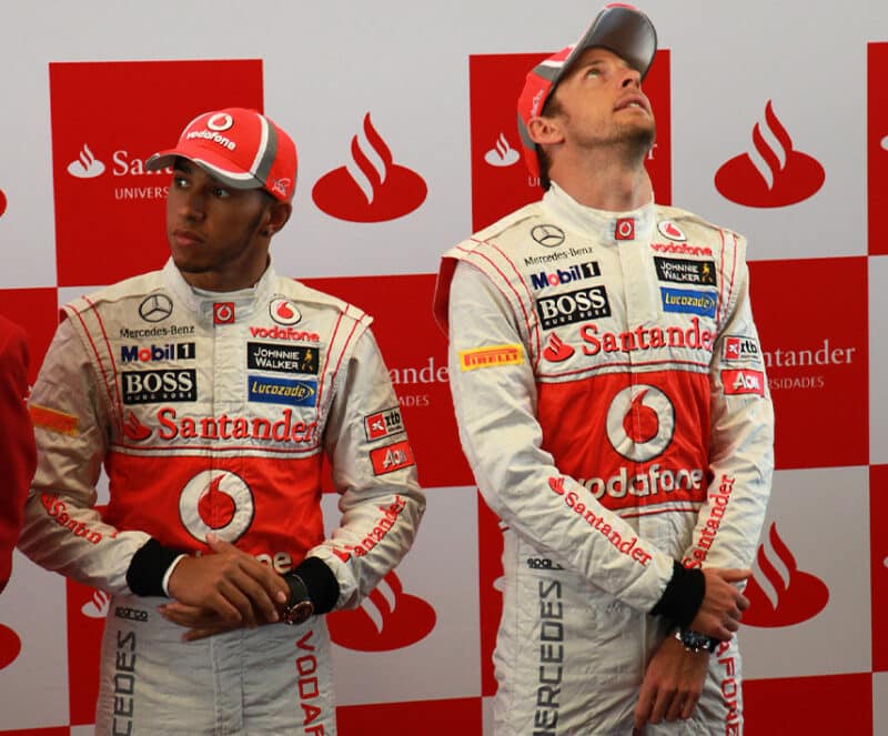 Lewis Hamilton and Jenson Button standing next to each other during the 2012 F1 season