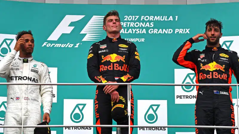 Max Verstappen stands atop the podium at the 2017 Malaysian GP