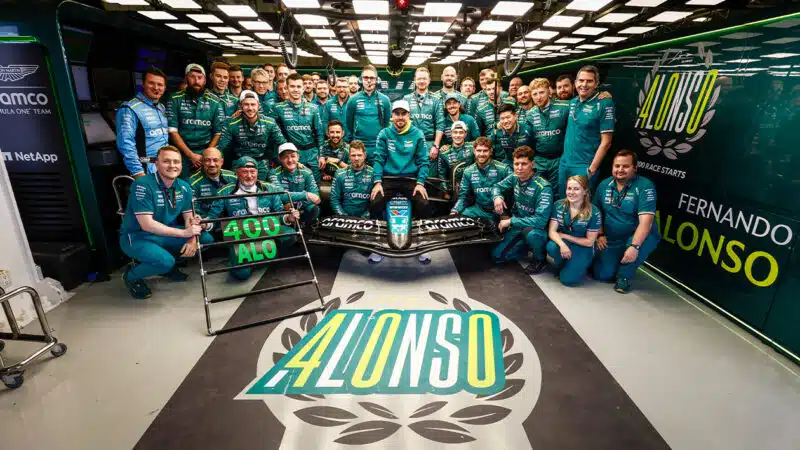 Aston Martin F1 team pose for a picture to mark Fernando Alonso 400th race entry