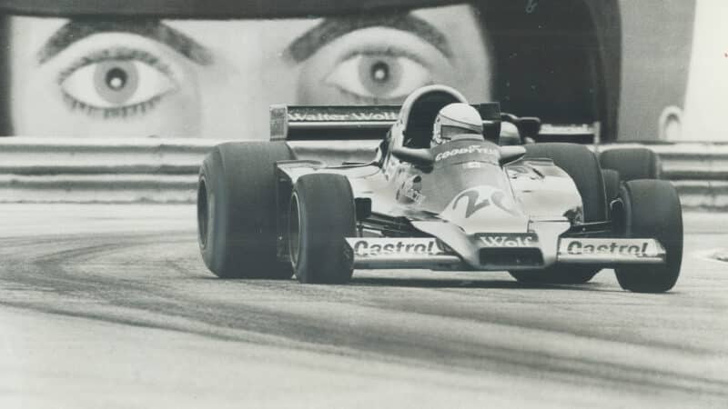 Eyes watch Wolf F1 car of Jody Scheckter from a billboards at the 1977 Canadian Grand Prix at Mosport