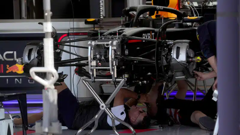 FIA official underneath Red Bull F1 car at 2024 United States Grand Prix