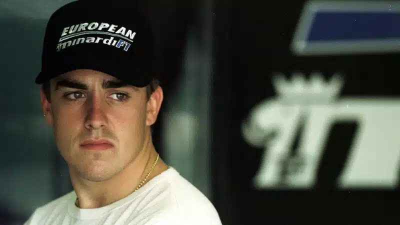 Fernando Alonso in Minardi F1 pit garage in 2001