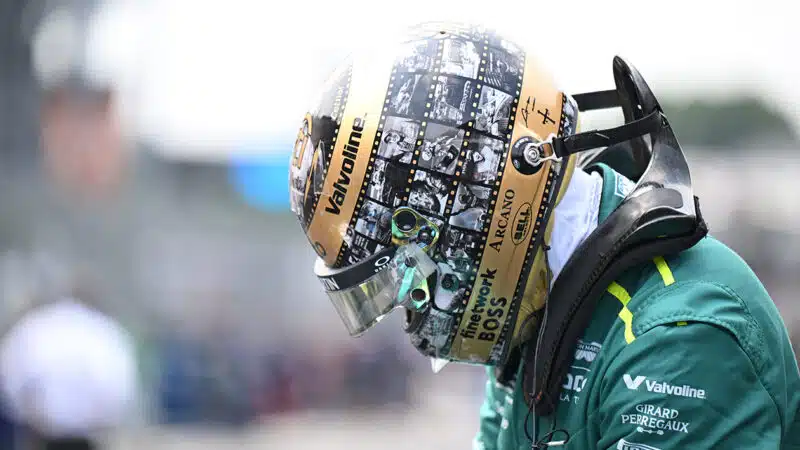 Fernando Alonso with head bowed in bespoke helmet for his 400th race entry at 2024 F1 Mexican Grand Prix