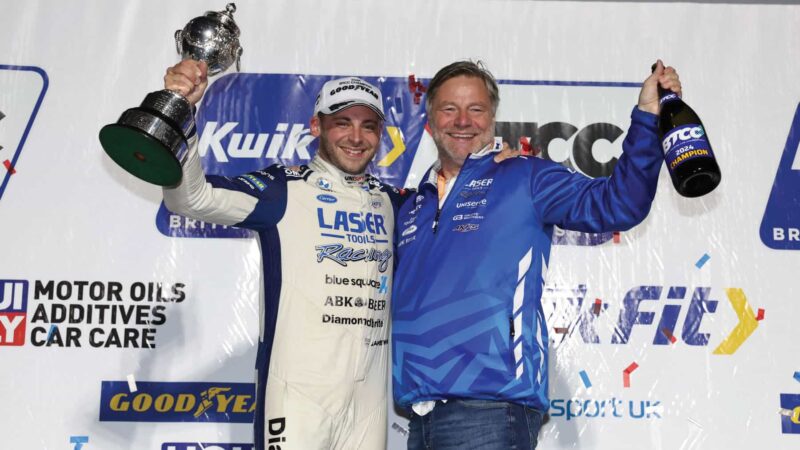 Jake Hill lifting the BTCC trophy