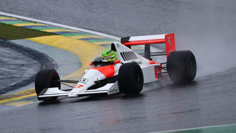 Lewis Hamilton in 1990 Ayrton Senna McLaren F1 car at Sao Pualo GP