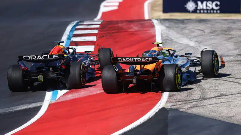 Max Verstappen runs Lando Norris oput wide at the start of the 2024 F1 US Grand Prix