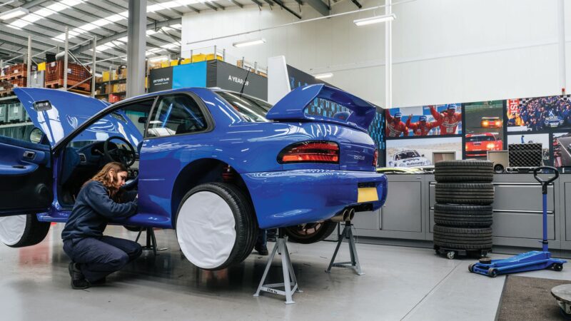 Mechanic works on Impreza prodrive