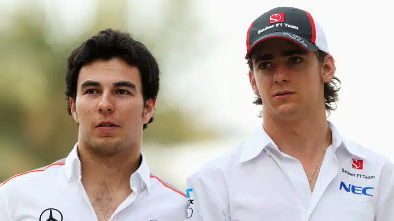 Sergio Perez of McLaren and Esteban Gutierrez of Sauber walk in the paddock following practice for the Bahrain Formula One Grand Prix at the Bahrain International Circuit on April 19, 2013