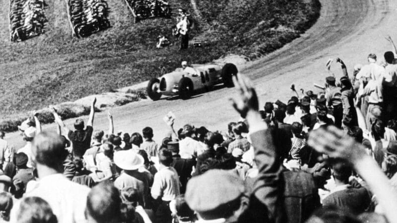 The crowd salutes Rosemeyer 1936 German GP