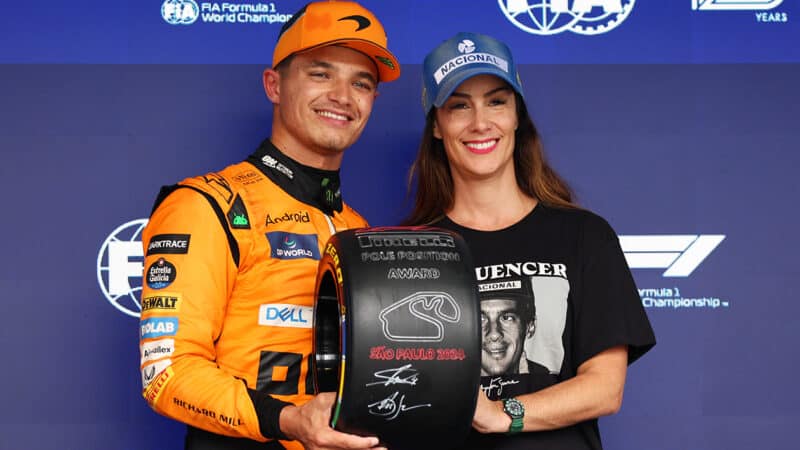 Vivianne Senna presents Lando Norris with commorative tyre for pole position in 2024 F1 Sao Paulo GP