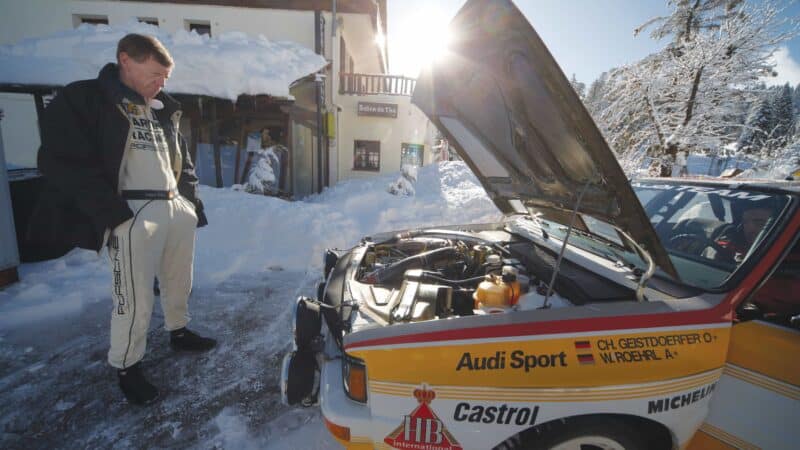 Walter Röhrl surveys the engine bay of the A2