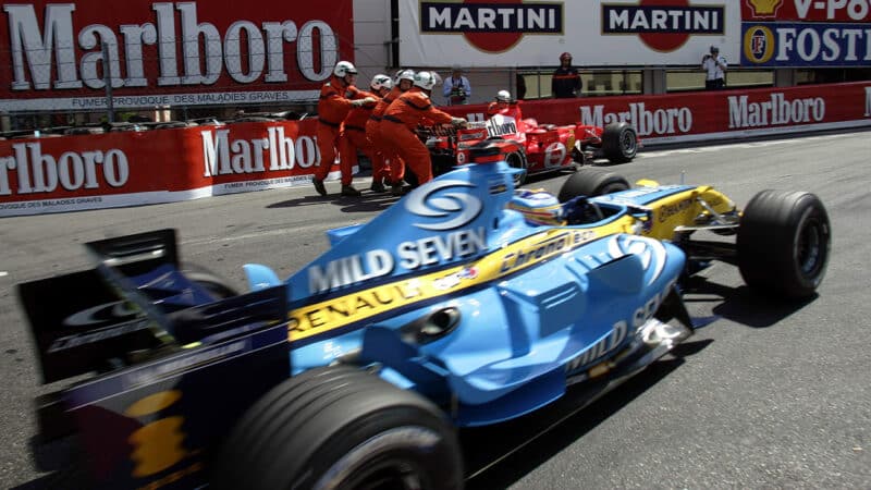 Fernando Alonso drives past stalled ferrari of Michael Schumacher in 2006 F1 Monaco Grand Prix qualifying