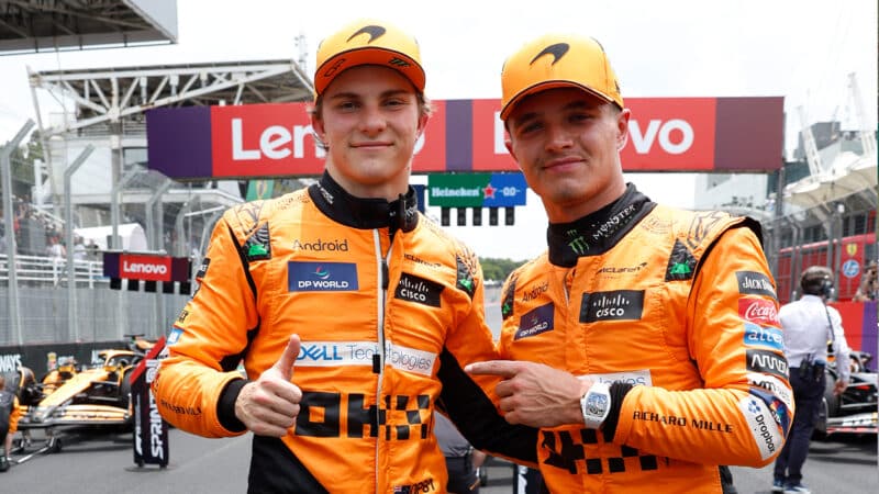 Lando Norris points to Oscar Piastri after he claimed pole for the 2024 F1 Brazilian Grand Prix sprint race