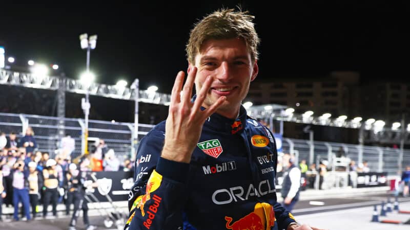 Max Verstappen holds up four fingers after winning his fourth F1 championship at the 2024 Las Vegas Grand Prix