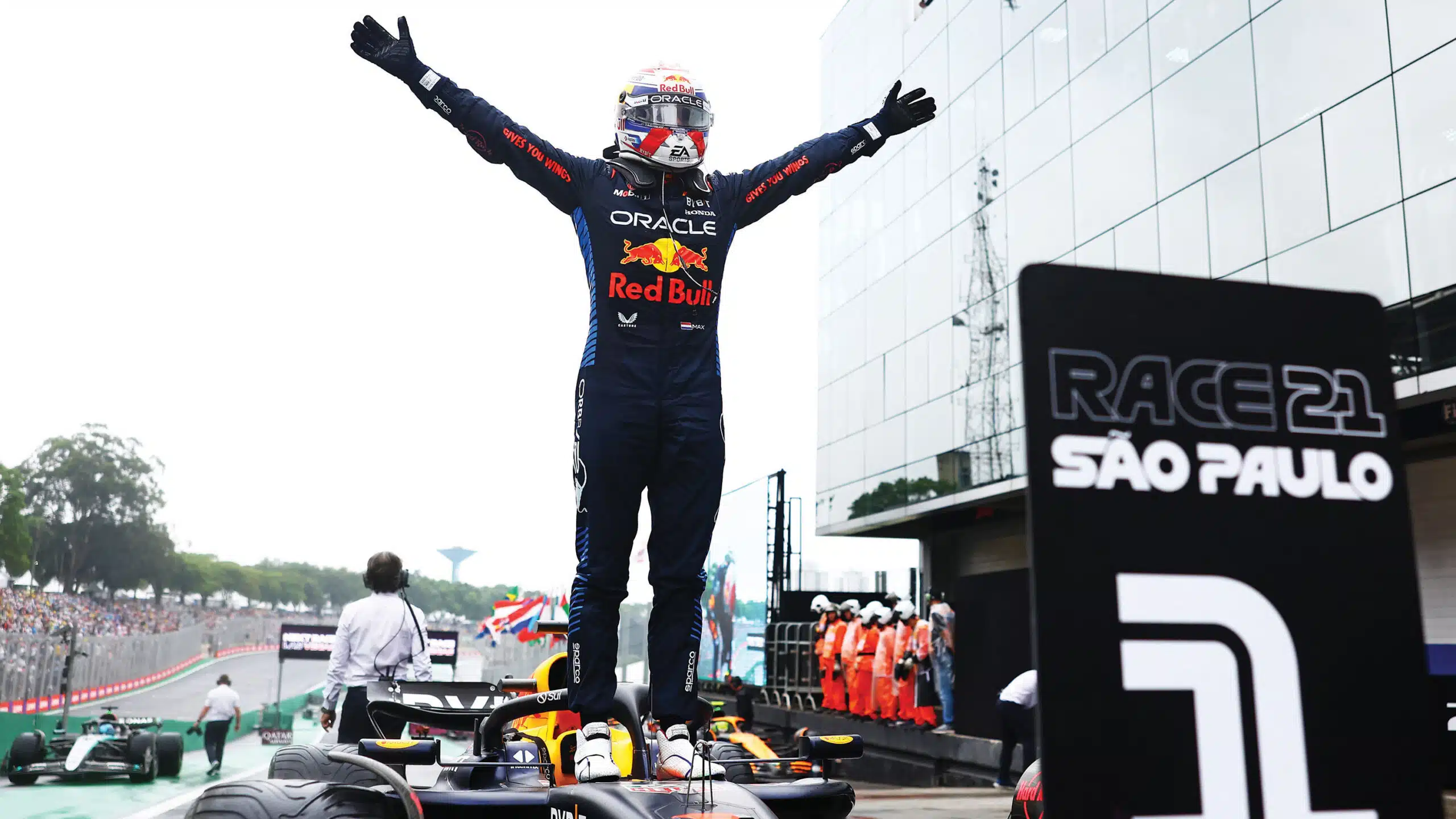 Max Verstappen stands on car at 2024 Sao Paulo