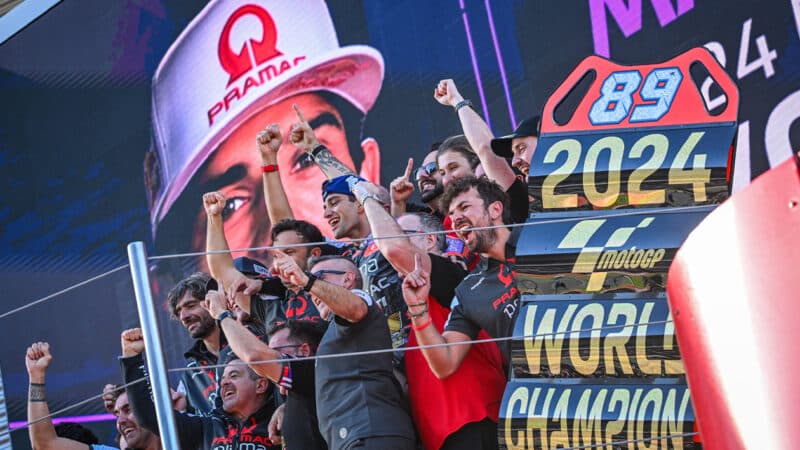 Pramac Ducati team celebrate with Jorge Martin on Barcelona podium after winning 2024 MotoGP championship