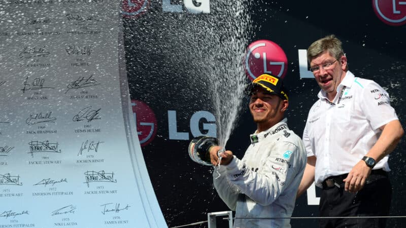 Ross Brawn with Lewis Hamilton on 2013 F1 Hungarian GP podium