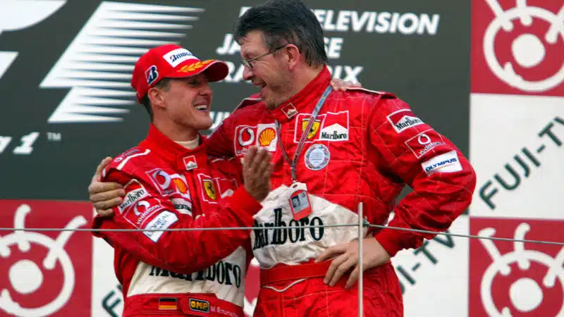 Ross Brawn with Michael Schumacher on 2004 F1 Japanese GP podium