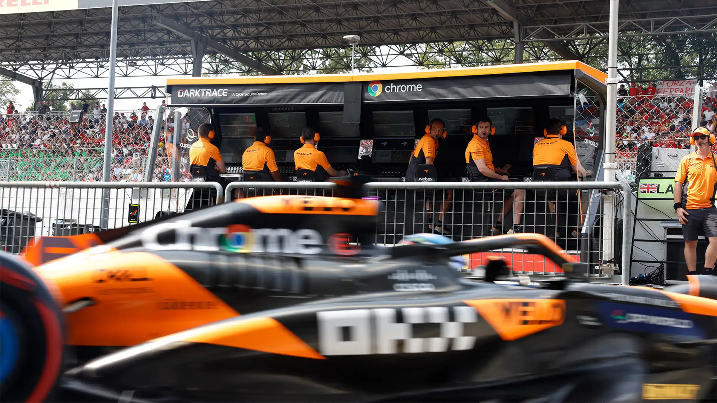 Oscar Piastri leaves McLaren F1 pit garage