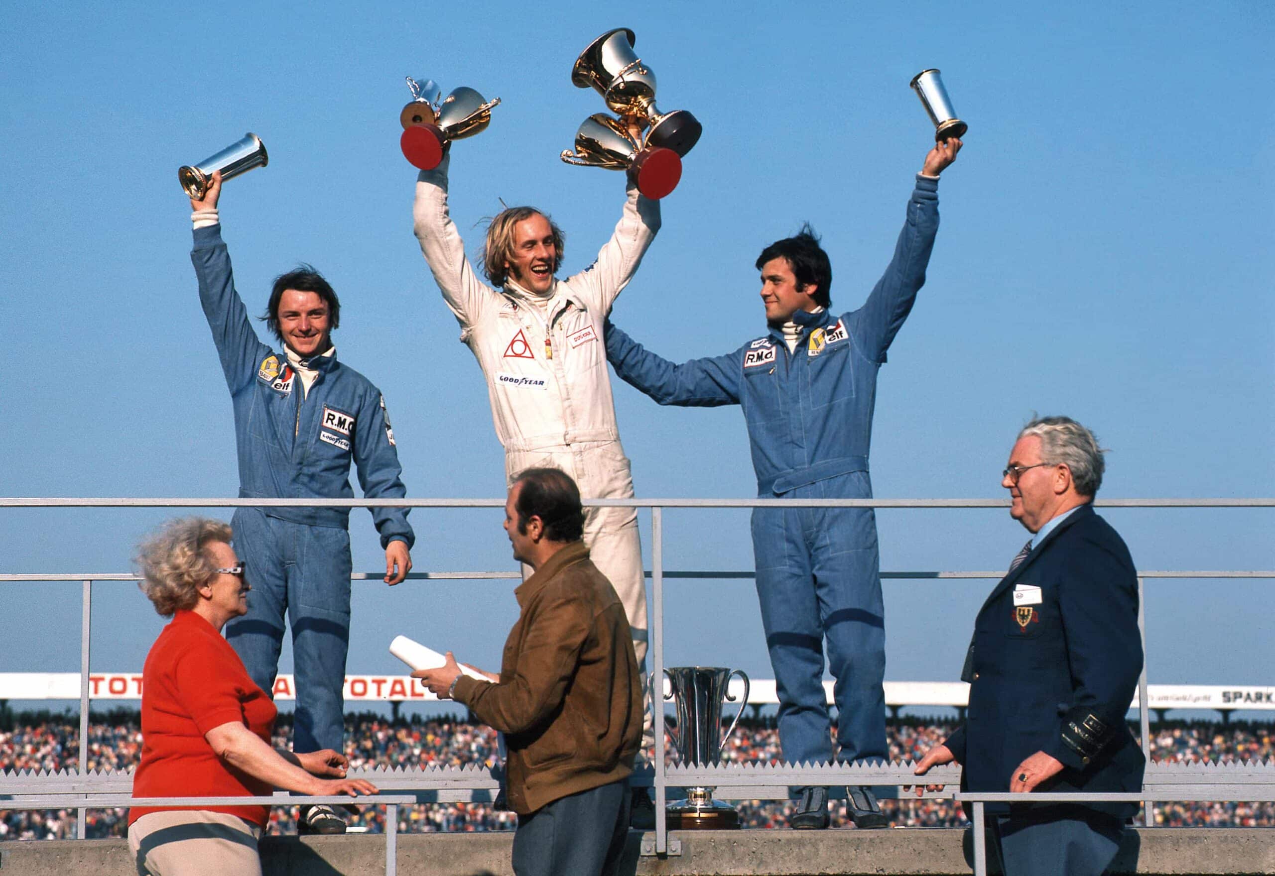 Joachim Stuck René Arnoux, and Patrick Tambay on the podium